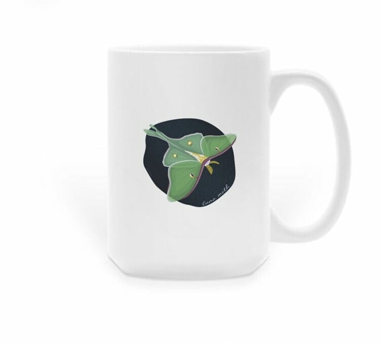 White mug with luna moth illustration
